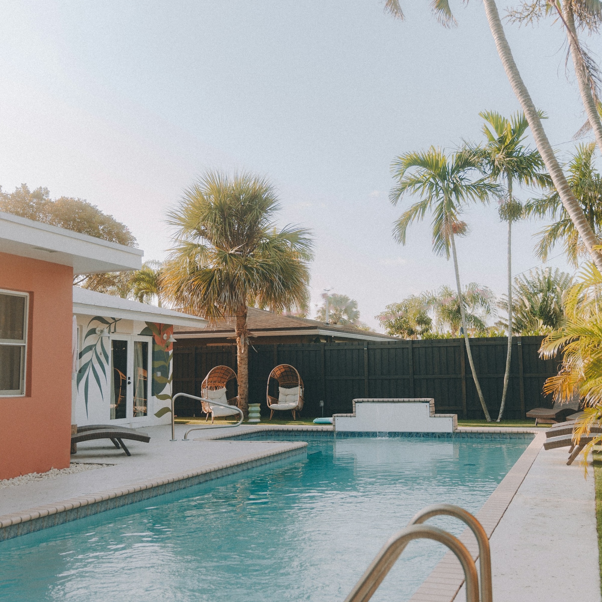 Florida backyard with pool and palm trees